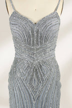Set against a light background, a mannequin presents a grey tulle gown. It has thin straps, a sweetheart neckline, and a mermaid - shaped skirt. The detailed silver bead embroidery creates an elegant pattern, making it ideal for formal events like proms, radiating sophistication.3