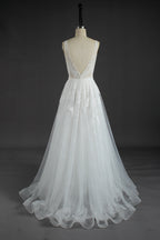 This wholesale wedding dress showcases intricate beaded lace on a sheer bodice, featuring a deep V - neckline for a touch of allure. The flowing tulle skirt, adorned with delicate lace patterns, creates a dreamy and romantic silhouette. The open back design adds to its charm. Crafted for brides seeking elegance and sophistication, it’s an ideal choice for creating unforgettable wedding moments. Bridal shops can stock up on bulk orders to offer this exquisite, eye - catching gown to their customers.02