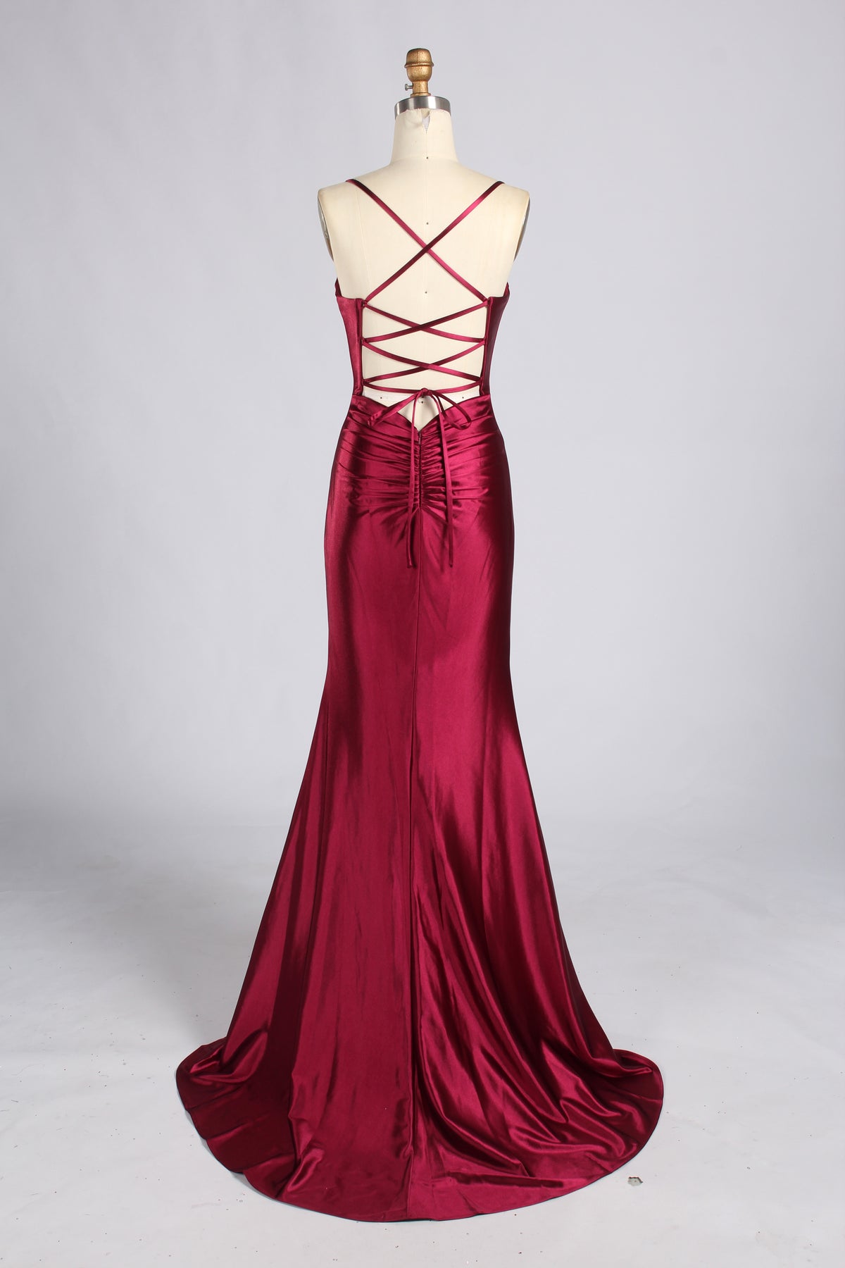 Burgundy satin mermaid prom dress with spaghetti straps, crisscross lace-up back