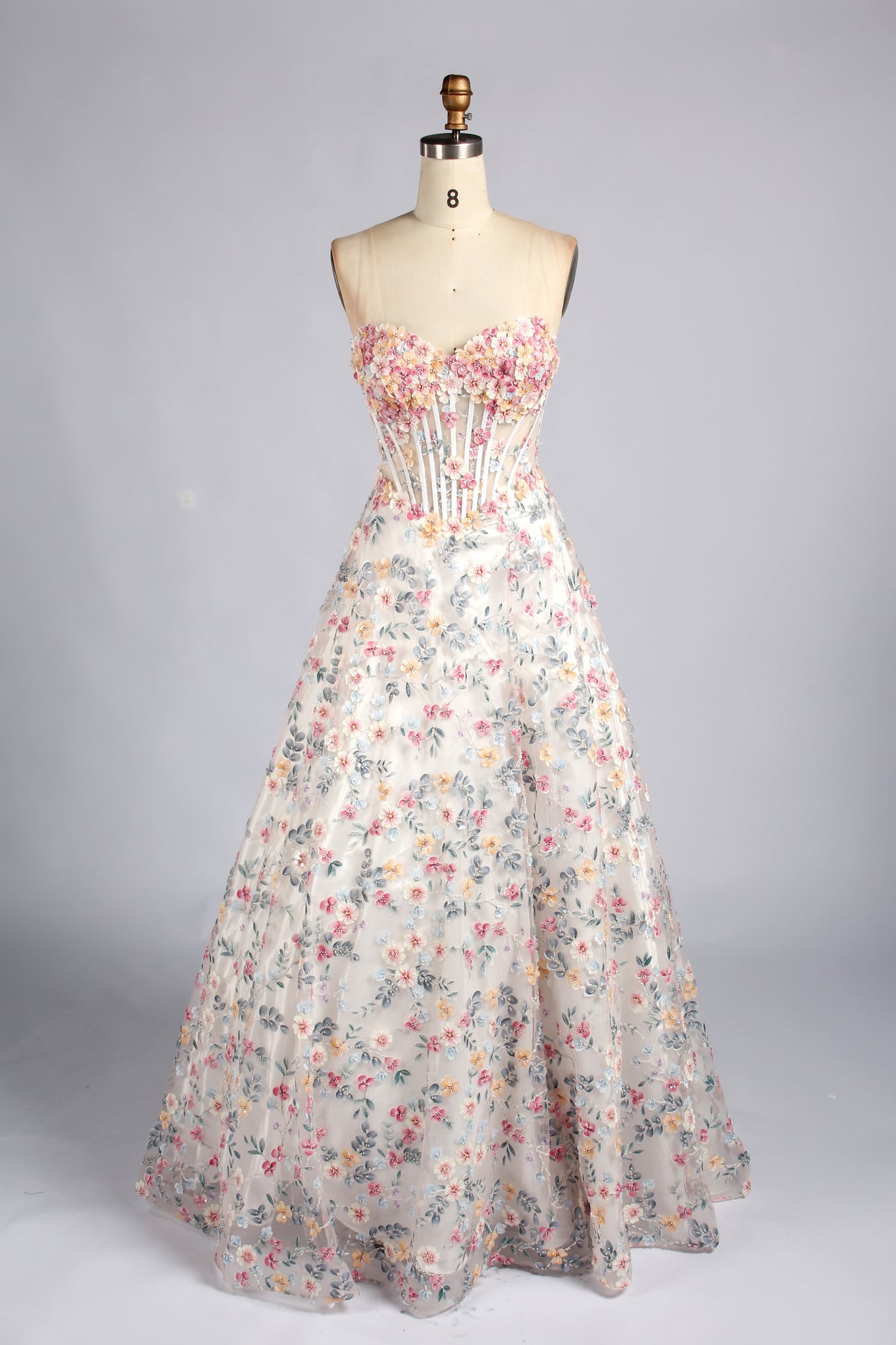 Strapless floral appliqué corset A-line prom dress with fitted bodice and full skirt