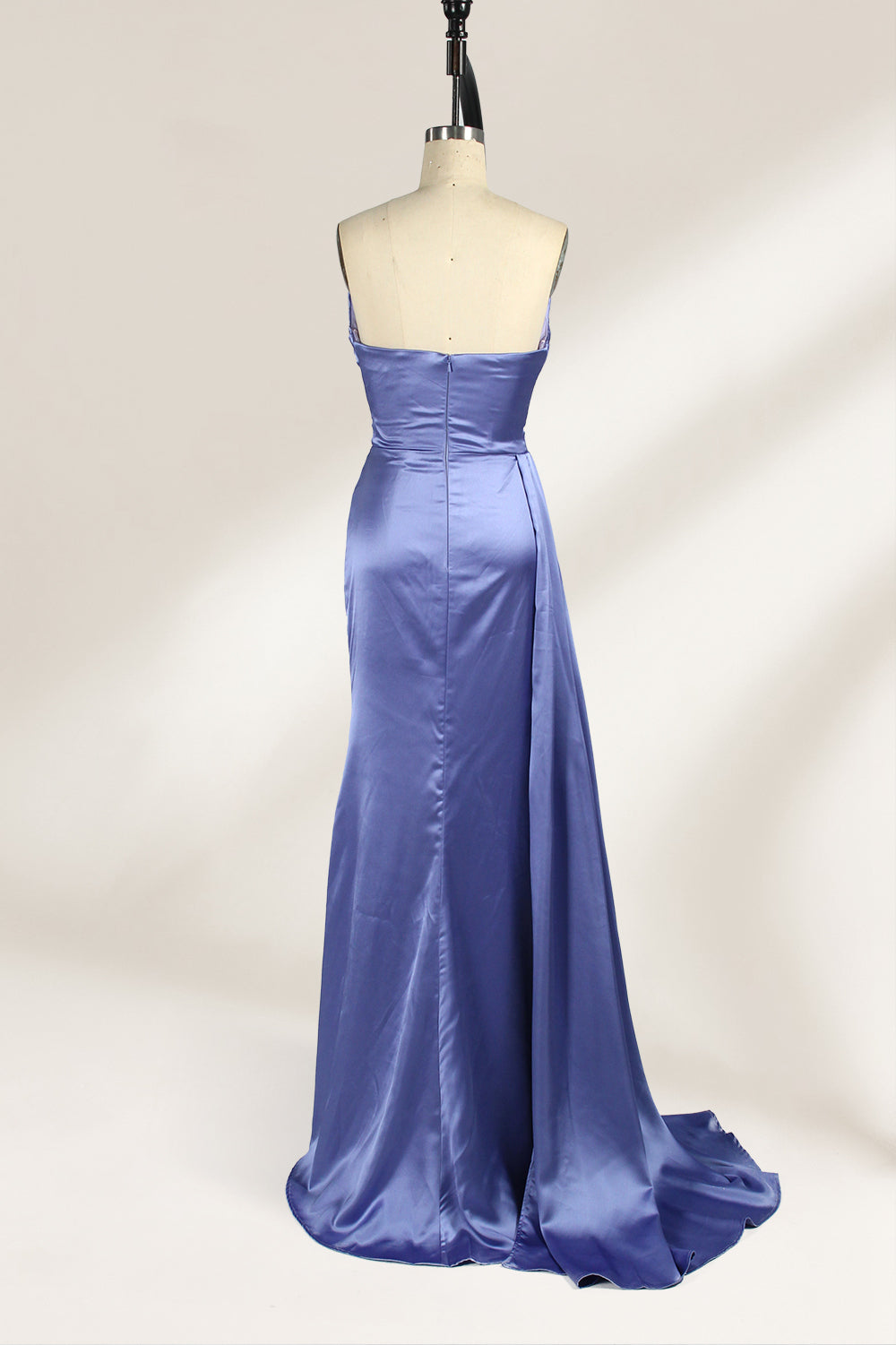 A strapless, lavender - blue satin evening gown is displayed on a mannequin. It features a draped bodice, ruched detailing on the skirt, a high side slit, and a flowing train, creating an elegant and graceful look, suitable for formal occasions.2