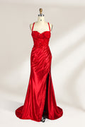 On a mannequin against a light background, there’s a red satin gown. It has thin, delicate straps and a sweetheart neckline. The bodice is adorned with sequin - detailed lace, adding a touch of glamour. The skirt, ruched and mermaid - shaped, features a high side slit and a flowing train. The shiny satin fabric and sequin embellishments make it perfect for formal events like galas.1