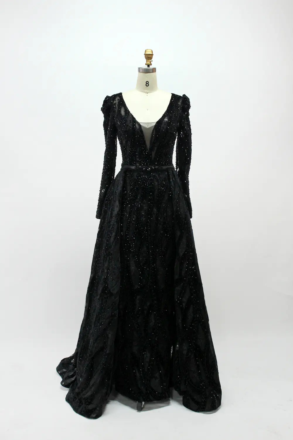 Black long-sleeve sequin evening dress with V-neck and flowing skirt