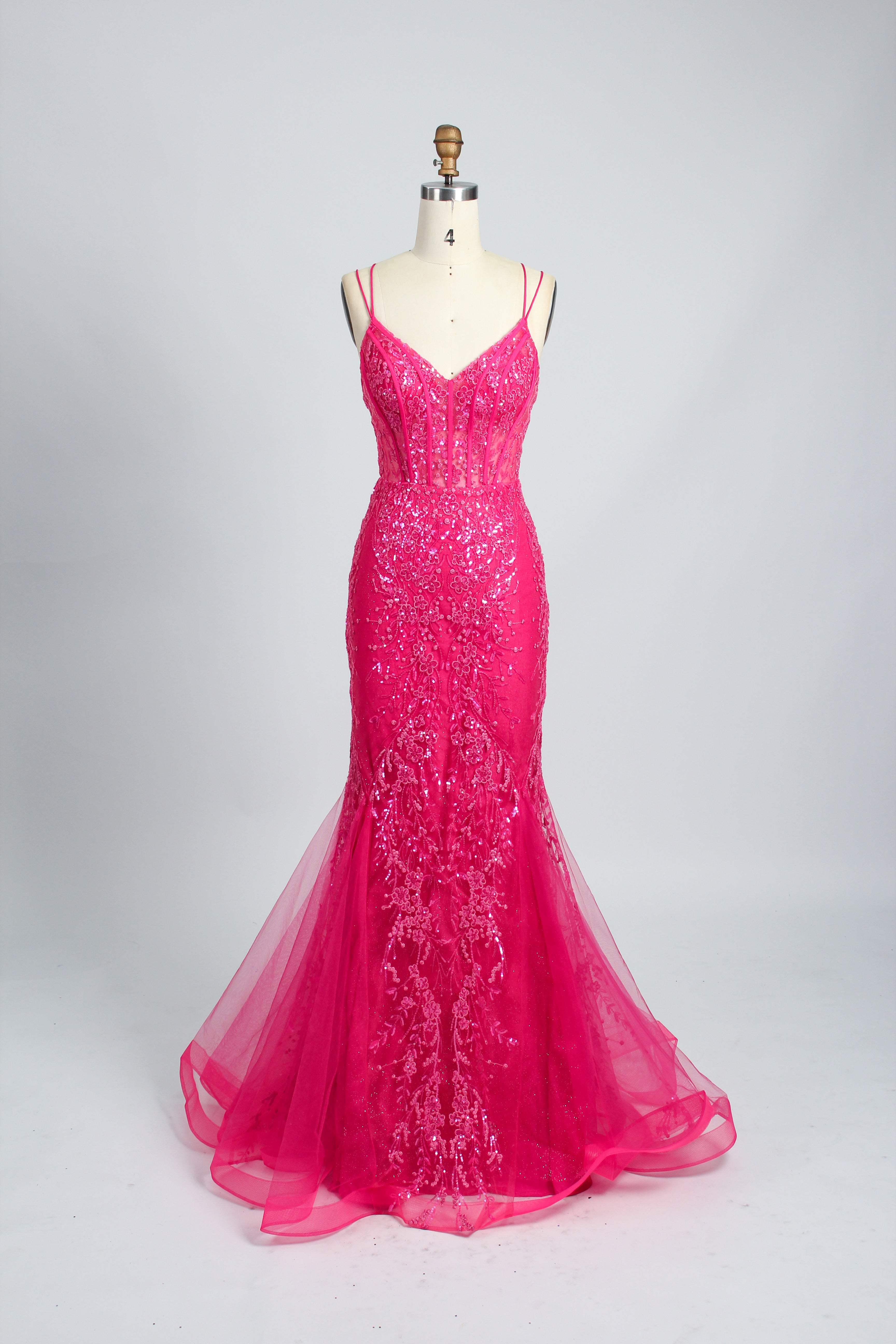 A woman stands against a light background, wearing a royal - blue, sequin - adorned mermaid gown. It features thin straps, a deep V - neckline, and a sheer tulle overlay. The sparkling sequins and figure - hugging silhouette create a glamorous look, perfect for formal events like galas or proms, exuding elegance and charm.6