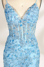 A mannequin showcases a light - blue tulle gown. It has thin straps, a V - neck, floral embroidery, and a high side slit. The intricate design, with sheer bodice details, suits formal events like galas or proms, radiating elegance and charm.3