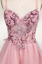 A mannequin displays a pink tulle gown. It features thin straps, a sweetheart neckline, intricate floral appliqués with sequins on the bodice, and a multi - layered, ruffled tulle skirt. The elegant design creates a romantic and glamorous look, perfect for formal events like proms or weddings.6
