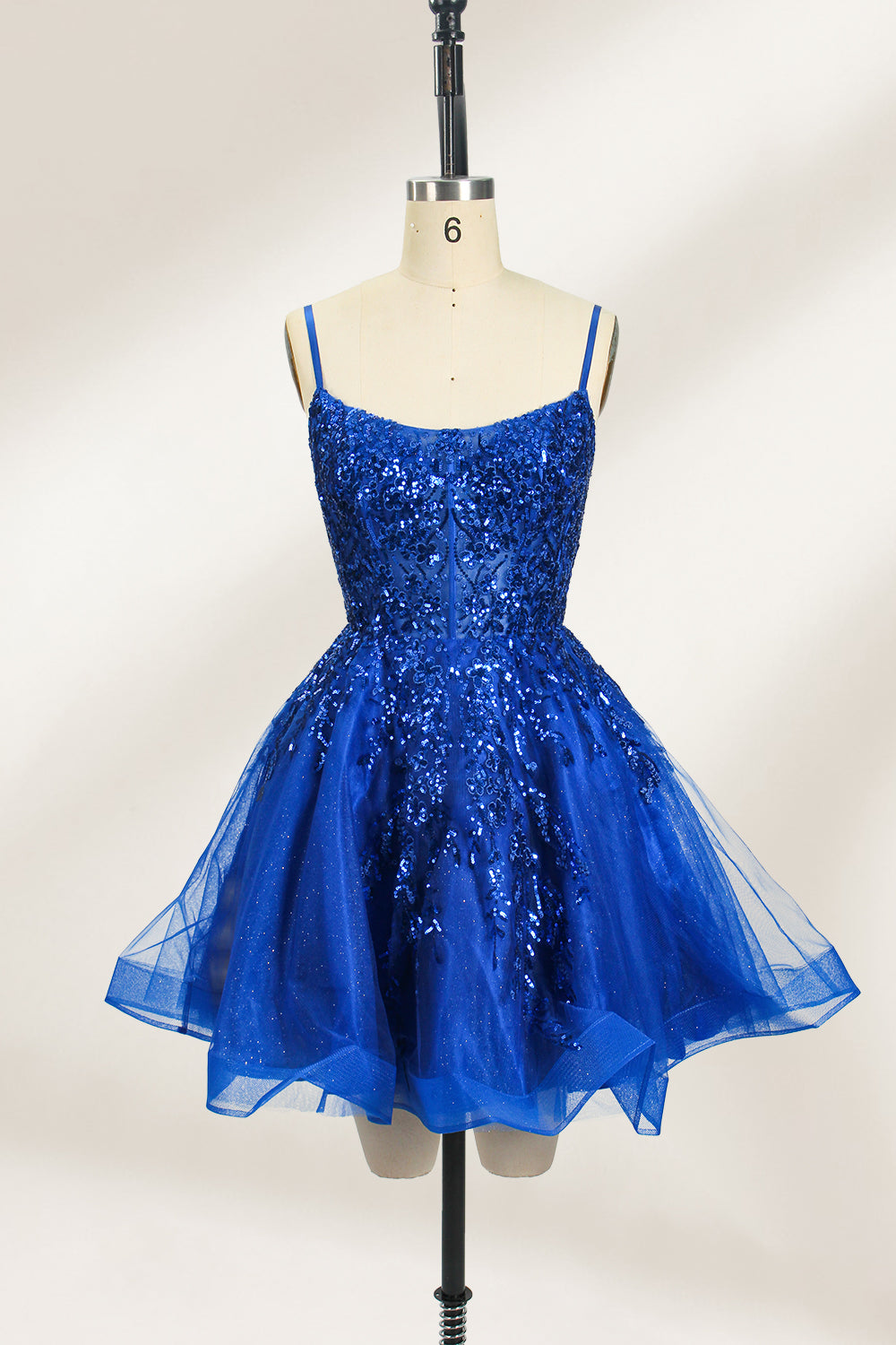 A mannequin displays a royal - blue, short - length gown with thin straps. The bodice and skirt are adorned with sparkling sequins and floral lace. The tulle skirt adds a fluttery, feminine touch, perfect for semi - formal events like homecoming or cocktail parties, exuding youthful charm.1