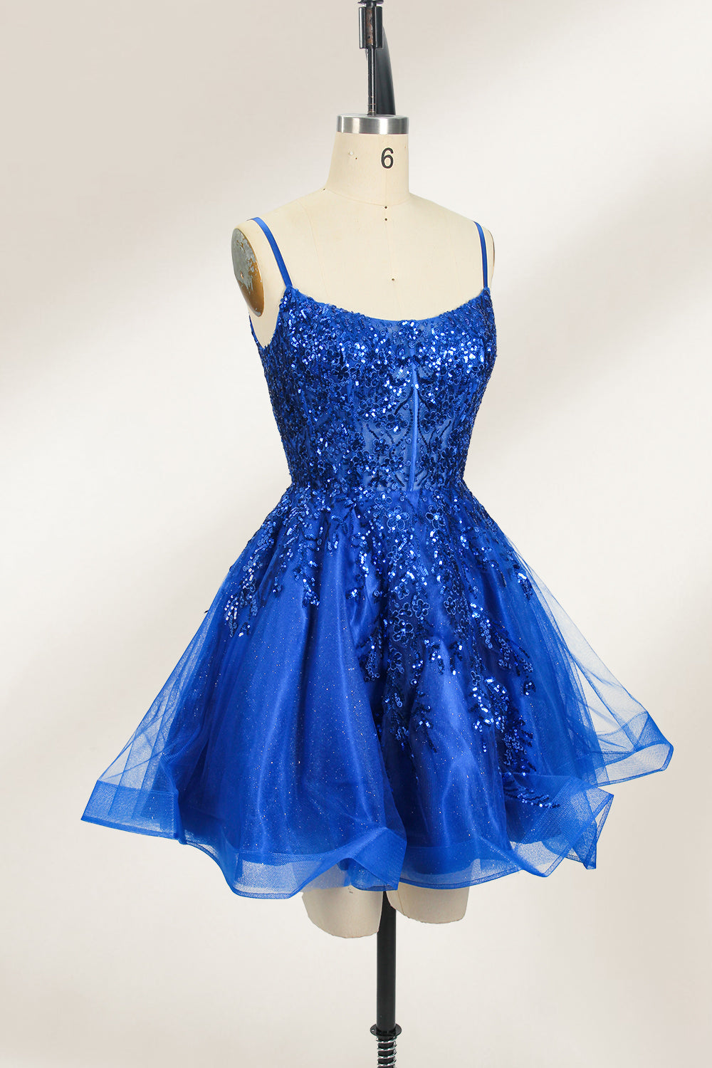 A mannequin displays a royal - blue, short - length gown with thin straps. The bodice and skirt are adorned with sparkling sequins and floral lace. The tulle skirt adds a fluttery, feminine touch, perfect for semi - formal events like homecoming or cocktail parties, exuding youthful charm.5