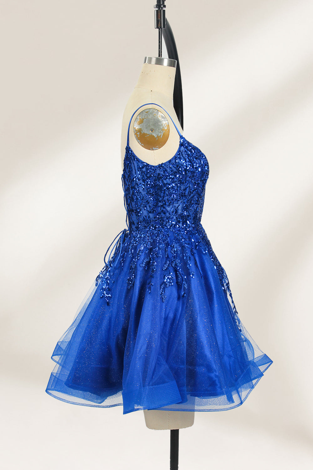 A mannequin displays a royal - blue, short - length gown with thin straps. The bodice and skirt are adorned with sparkling sequins and floral lace. The tulle skirt adds a fluttery, feminine touch, perfect for semi - formal events like homecoming or cocktail parties, exuding youthful charm.5
