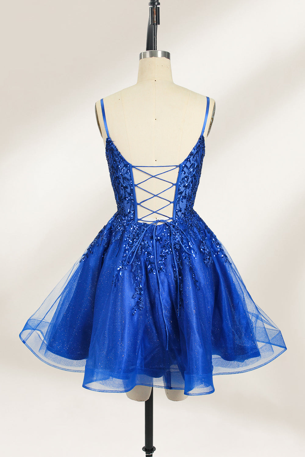 A mannequin displays a royal - blue, short - length gown with thin straps. The bodice and skirt are adorned with sparkling sequins and floral lace. The tulle skirt adds a fluttery, feminine touch, perfect for semi - formal events like homecoming or cocktail parties, exuding youthful charm.2