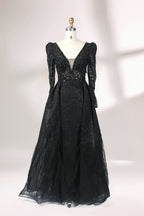 Illuminated softly, a mannequin showcases a light - gray evening gown. With a deep V - neckline, long puffed sleeves, and elaborate bead and lace embroidery, the gown exudes an air of luxury and sophistication, making it an excellent choice for formal galas and upscale events.6