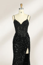 Set against a light background, a mannequin presents a blue gown adorned with sequins. It has thin straps, a deep V - neckline, and a mermaid - shaped skirt with a high side slit. The intricate sequin patterns and sheer bodice with embroidery add glamour, ideal for proms or formal dinners.3