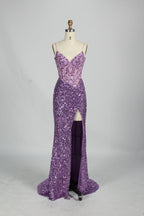 Set against a light background, a mannequin presents a blue gown adorned with sequins. It has thin straps, a deep V - neckline, and a mermaid - shaped skirt with a high side slit. The intricate sequin patterns and sheer bodice with embroidery add glamour, ideal for proms or formal dinners.9