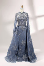 Presented on a mannequin is a blue - toned evening gown. It has a high neckline, long sheer sleeves, and intricate floral embroidery. The elegant design gives off a luxurious and sophisticated vibe, ideal for formal occasions.3