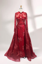 Presented on a mannequin is a blue - toned evening gown. It has a high neckline, long sheer sleeves, and intricate floral embroidery. The elegant design gives off a luxurious and sophisticated vibe, ideal for formal occasions.1