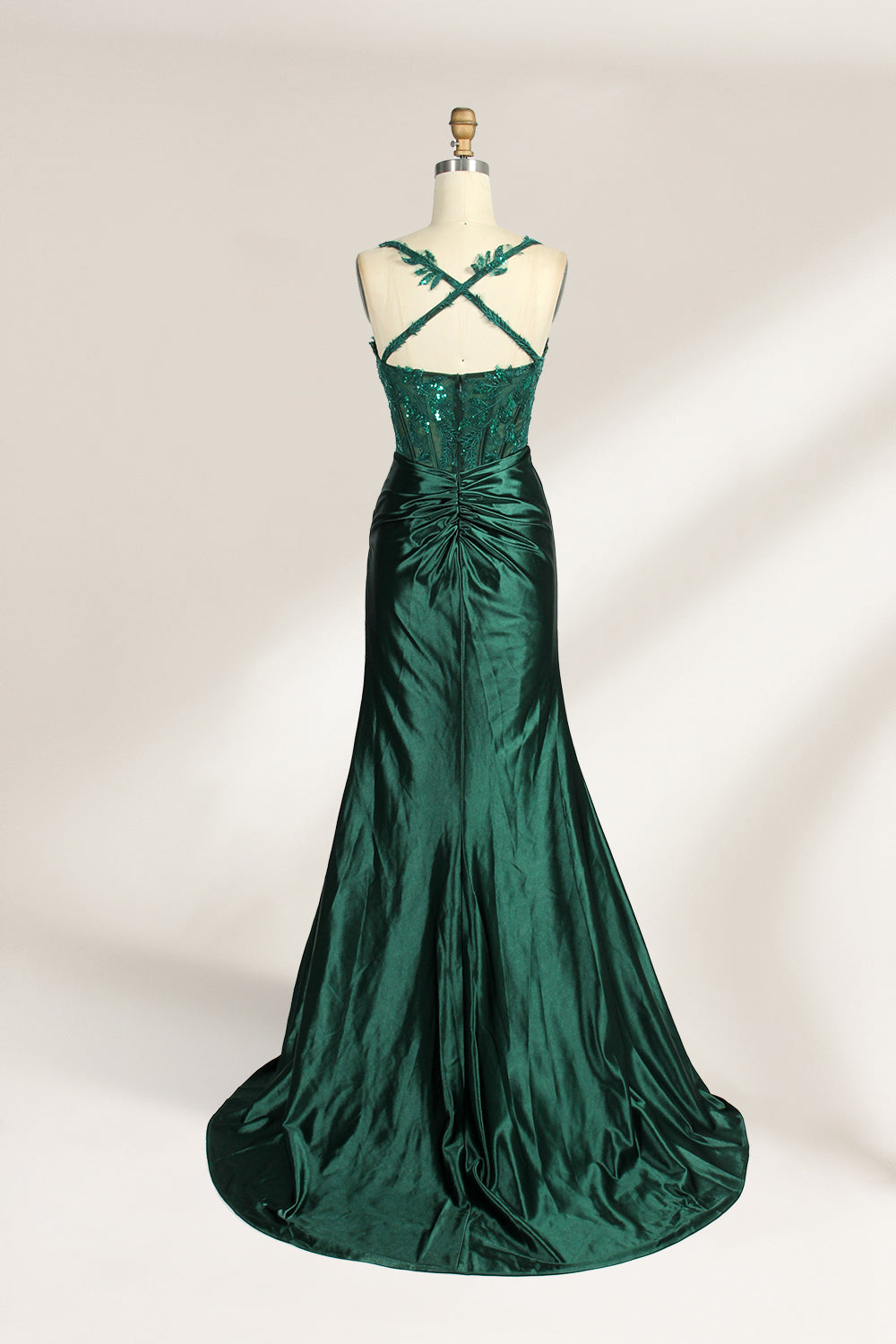 On a mannequin against a light background, there’s a red satin gown. It has thin, delicate straps and a sweetheart neckline. The bodice is adorned with sequin - detailed lace, adding a touch of glamour. The skirt, ruched and mermaid - shaped, features a high side slit and a flowing train. The shiny satin fabric and sequin embellishments make it perfect for formal events like galas.2