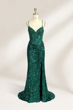 Set against a light background, a mannequin presents a blue gown adorned with sequins. It has thin straps, a deep V - neckline, and a mermaid - shaped skirt with a high side slit. The intricate sequin patterns and sheer bodice with embroidery add glamour, ideal for proms or formal dinners.5