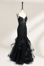 A mannequin displays a black mermaid - style gown. It has thin straps, a deep V - neckline with sheer panels, and intricate black bead embroidery. The layered tulle skirt adds a romantic touch, perfect for formal events like galas or weddings, exuding elegance and sophistication.4