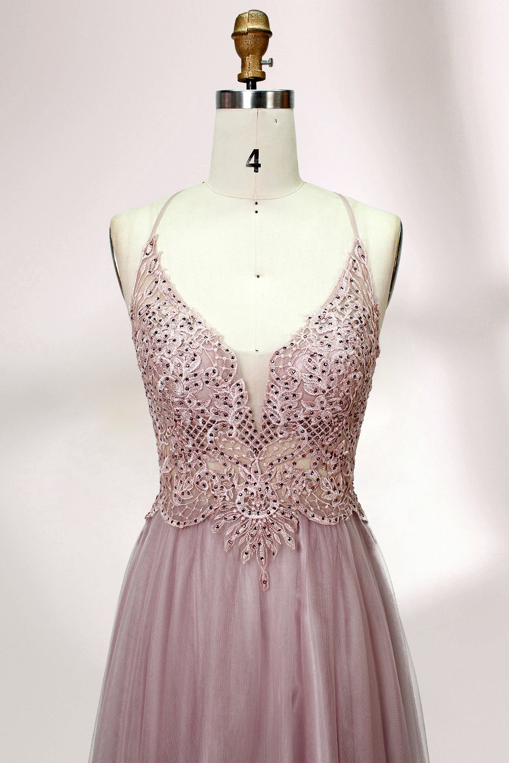 Blush pink tulle prom dress with beaded sheer bodice, V-neck, criss-cross back & flowing skirt. Elegant, dreamy design—perfect for bulk premium partywear stock.04