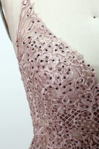 Blush pink tulle prom dress with beaded sheer bodice, V-neck, criss-cross back & flowing skirt. Elegant, dreamy design—perfect for bulk premium partywear stock.05
