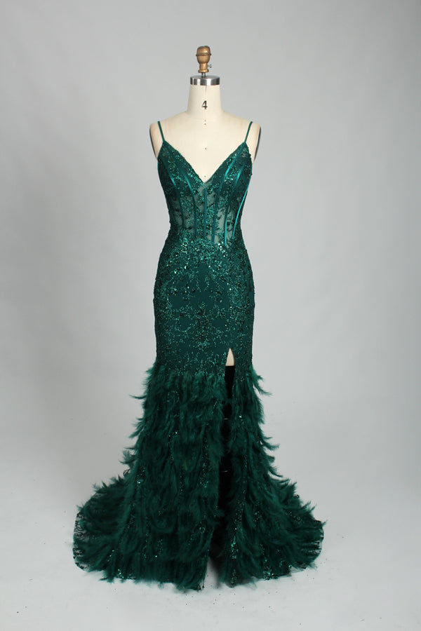 Illuminated softly, a woman captivates in a pink - purple evening gown. With sequin and feather details, a mermaid silhouette, and a high slit, it creates a glamorous and alluring look for formal events.9