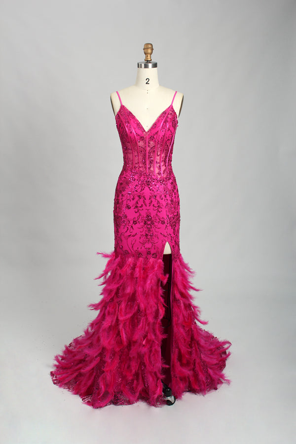 Illuminated softly, a woman captivates in a pink - purple evening gown. With sequin and feather details, a mermaid silhouette, and a high slit, it creates a glamorous and alluring look for formal events.10