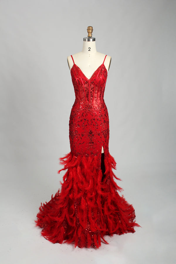 Illuminated softly, a woman captivates in a pink - purple evening gown. With sequin and feather details, a mermaid silhouette, and a high slit, it creates a glamorous and alluring look for formal events.11