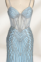 A close - up of a light - blue tulle gown with intricate silver beading. It has a strapless, sweetheart neckline and sheer bodice. The geometric beading pattern adds glamour, perfect for formal events like galas, radiating charm.3