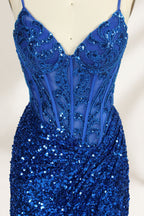 Set against a light background, a mannequin presents a blue gown adorned with sequins. It has thin straps, a deep V - neckline, and a mermaid - shaped skirt with a high side slit. The intricate sequin patterns and sheer bodice with embroidery add glamour, ideal for proms or formal dinners.7