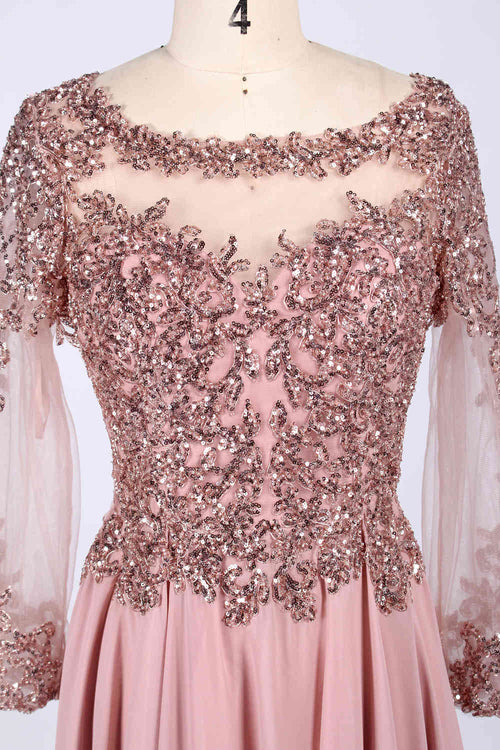 Front view of an elegant dusty rose A-line mother of the bride dress featuring a scoop neck sheer tulle bodice with shimmering sequin embellishments, sheer long sleeves with sequin cuffs, and a long flowing floor-length chiffon skirt, ideal for weddings or formal banquets and available for bulk production or wholesale ordering.