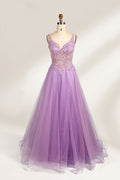 A mannequin showcases a lavender - purple tulle gown. It has a V - neck, beaded bodice, and a voluminous skirt. The elegant design, with intricate beadwork, suits formal events like galas or proms, radiating charm and grace.1