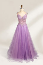 A mannequin showcases a lavender - purple tulle gown. It has a V - neck, beaded bodice, and a voluminous skirt. The elegant design, with intricate beadwork, suits formal events like galas or proms, radiating charm and grace.1