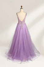 A mannequin showcases a lavender - purple tulle gown. It has a V - neck, beaded bodice, and a voluminous skirt. The elegant design, with intricate beadwork, suits formal events like galas or proms, radiating charm and grace.2