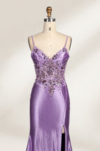 A mannequin showcases a lavender - purple satin gown. It has thin straps, a V - neck, floral - beaded bodice, and a high side slit. The elegant design, blending satin and intricate beadwork, suits formal events like galas or proms, radiating charm.3