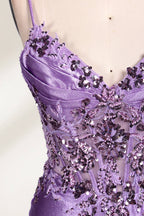 A mannequin showcases a lavender - purple satin gown. It has thin straps, a V - neck, floral - beaded bodice, and a high side slit. The elegant design, blending satin and intricate beadwork, suits formal events like galas or proms, radiating charm.4