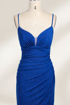 A mannequin showcases a royal - blue, glittery gown. It has thin straps, a ruched bodice, and a high side slit with a subtle train. The elegant design, with shimmering fabric, suits formal events like galas or proms, radiating sophistication.3
