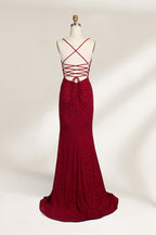 A mannequin showcases a royal - blue, glittery gown. It has thin straps, a ruched bodice, and a high side slit with a subtle train. The elegant design, with shimmering fabric, suits formal events like galas or proms, radiating sophistication.2