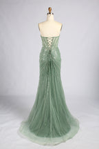 Sage green strapless mermaid prom dress with beaded corset back and crisscross lacing
