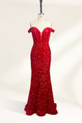 A photograph of a mannequin showcasing an off-the-shoulder, floor-length red sequin gown with a plunging V-neckline. The dress has a fitted bodice and a flared skirt, creating a glamorous, elegant appearance. The mannequin stands against a plain white background, emphasizing the dress's vibrant color and intricate details.01