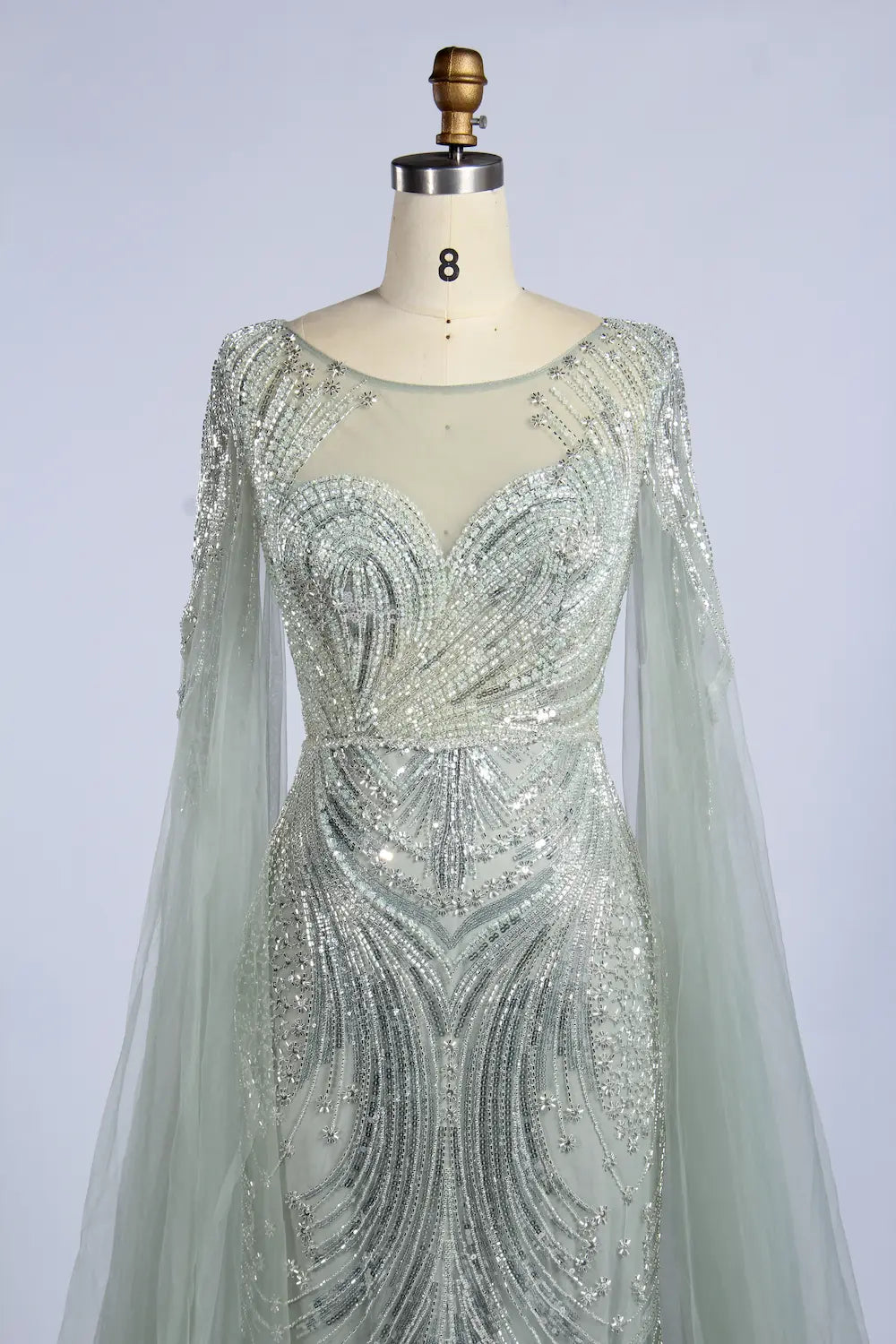 Silver sage beaded bodice fit-and-flare gown with long sheer cape sleeves