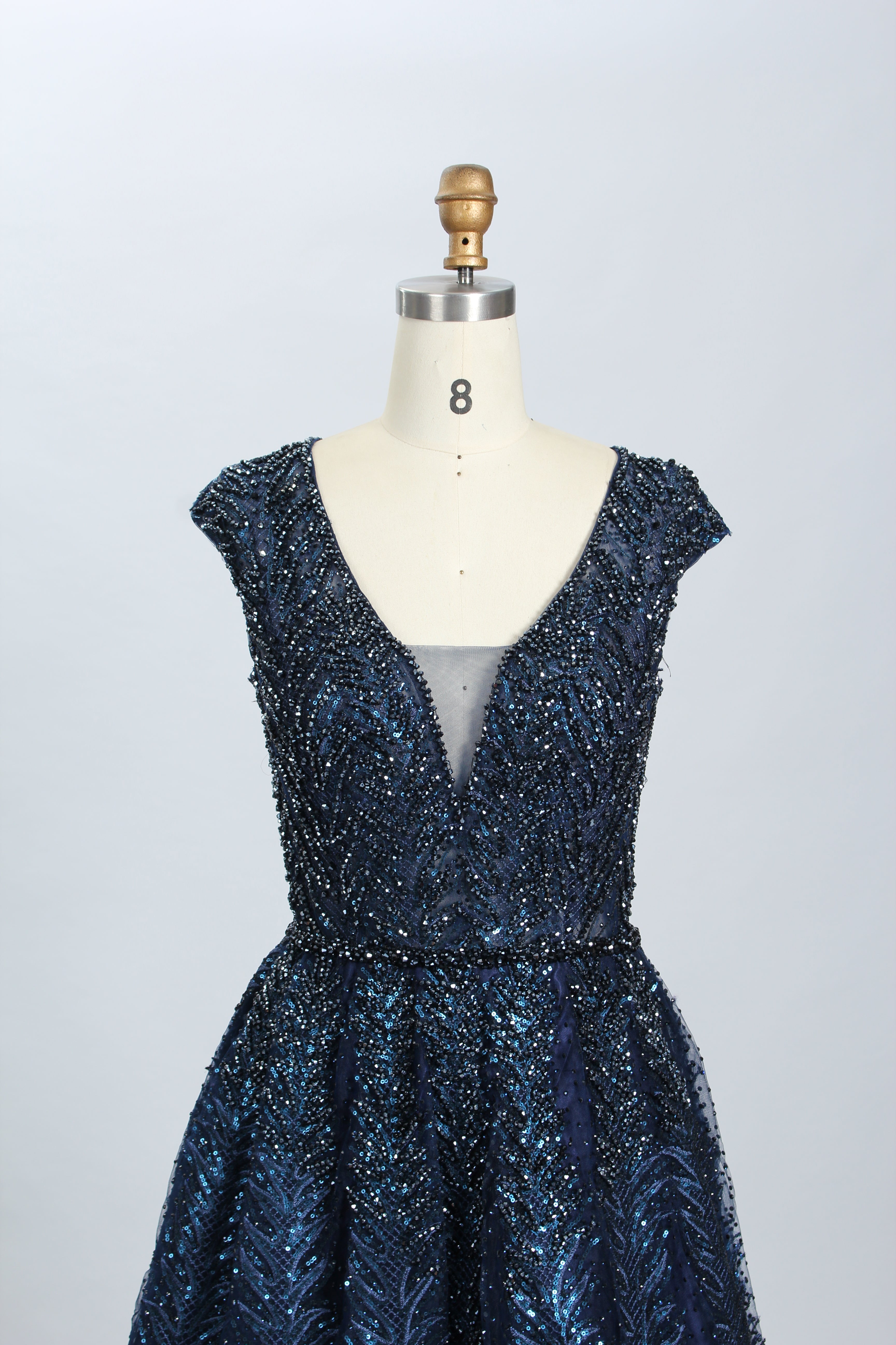 Navy sequined beaded ball gown with V-neck and short cap sleeves