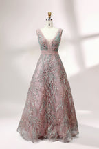 Displayed on a mannequin is a pink - hued evening gown. It features a deep V - neckline, intricate floral embroidery in shades of blue and pink, and a flowing skirt. The elegant design creates a romantic and sophisticated look, perfect for formal events.1