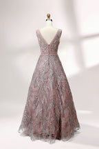 Displayed on a mannequin is a pink - hued evening gown. It features a deep V - neckline, intricate floral embroidery in shades of blue and pink, and a flowing skirt. The elegant design creates a romantic and sophisticated look, perfect for formal events.1