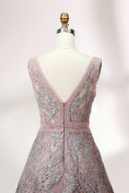 Displayed on a mannequin is a pink - hued evening gown. It features a deep V - neckline, intricate floral embroidery in shades of blue and pink, and a flowing skirt. The elegant design creates a romantic and sophisticated look, perfect for formal events.5
