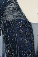 Navy beaded tulle with floral and geometric beadwork detail on sheer sleeve