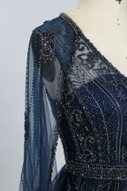 Navy beaded sheer sleeve panel with intricate floral motifs and sparkling accents