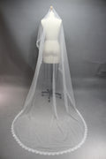 Enhance your bridal accessory offerings with our Wholesale Lace - Edged Long Bridal Veil, Style T267.