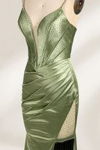 A mannequin showcases an olive - green satin gown. It has thin straps, a deep V - neck, ruched bodice, and a high side slit with sheer details. The elegant design, blending satin and intricate ruching, suits formal events like galas or proms, radiating sophistication.5