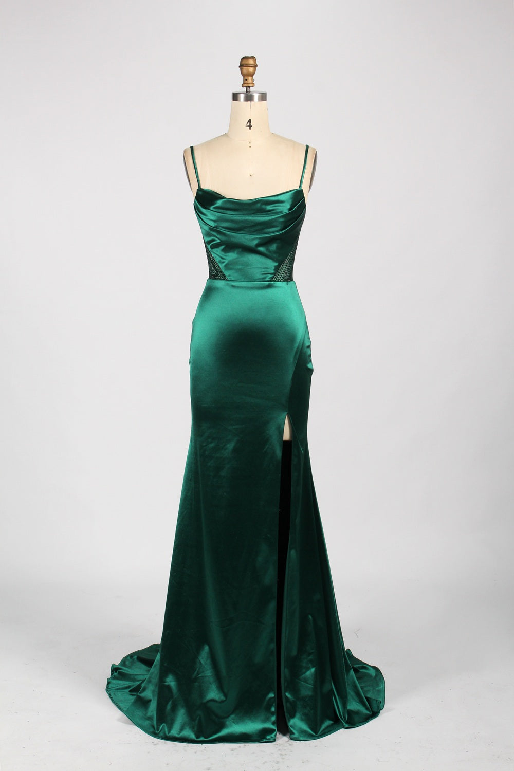 A woman with sleek dark hair and a poised stance wears a light - blue satin gown. It has thin straps, a cowl neckline, sheer mesh side panels, and a high side slit. Paired with understated earrings, the outfit radiates elegance, perfect for formal events like galas or evening receptions.8