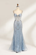 A close - up of a light - blue tulle gown with intricate silver beading. It has a strapless, sweetheart neckline and sheer bodice. The geometric beading pattern adds glamour, perfect for formal events like galas, radiating charm.1